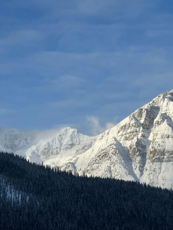 the large mountain range with snow covered peaks