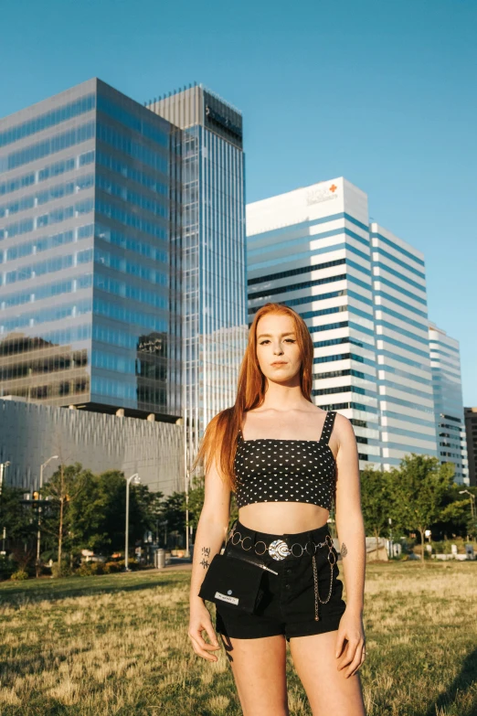 a girl posing for a picture in front of the building