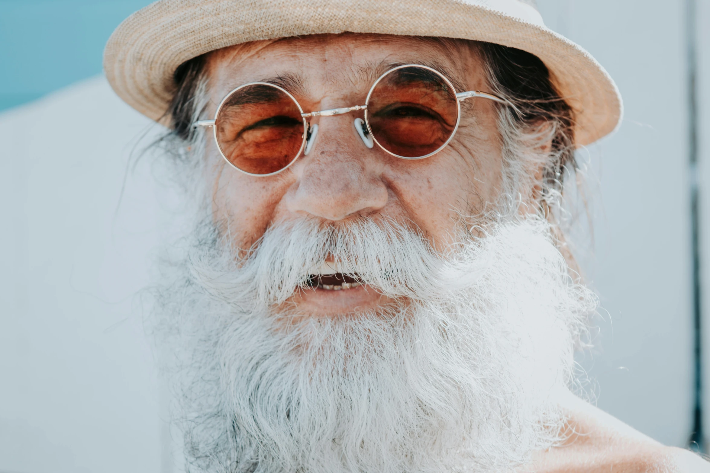 an older man with glasses and a big beard
