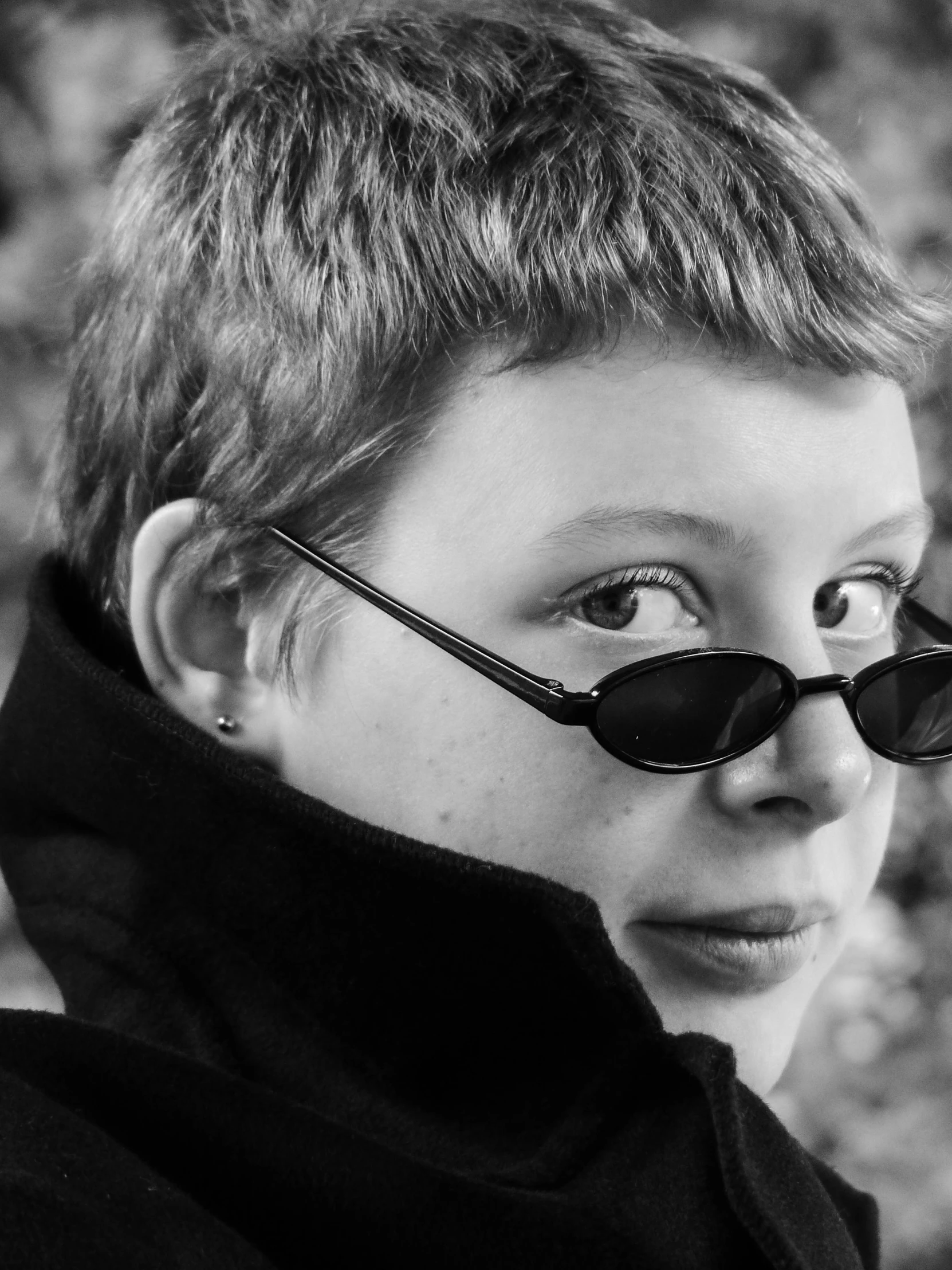 boy wearing black sunglasses and a hooded hood