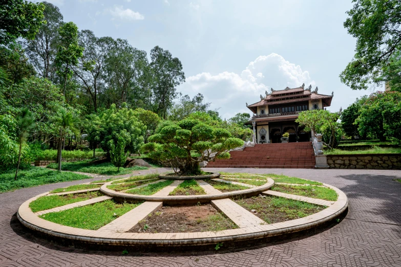 the circular garden is in a park setting