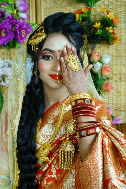 a woman with long black hair wearing a colorful dress