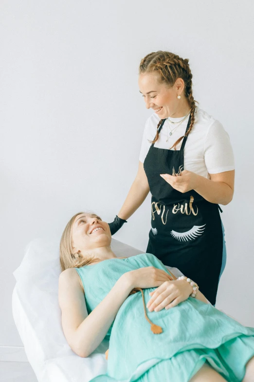 a woman getting her hair done while being styled