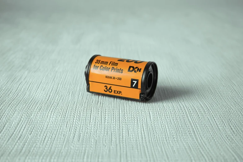 a small orange battery on the floor