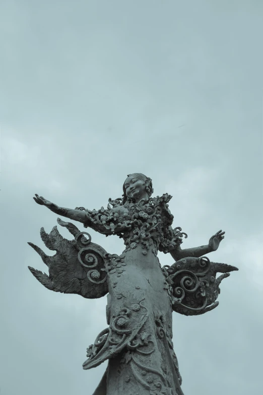 statue made of stone in an upward angle