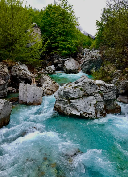 a small river flowing between two huge rocks