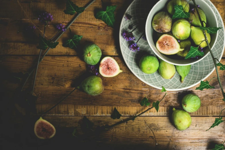 figurines and figs on a wooden table