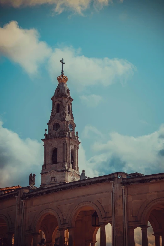 the clock tower at an old, ornate building in france