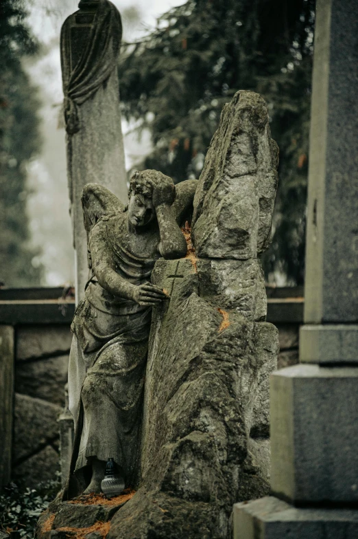 the statue shows a woman with an angel wings