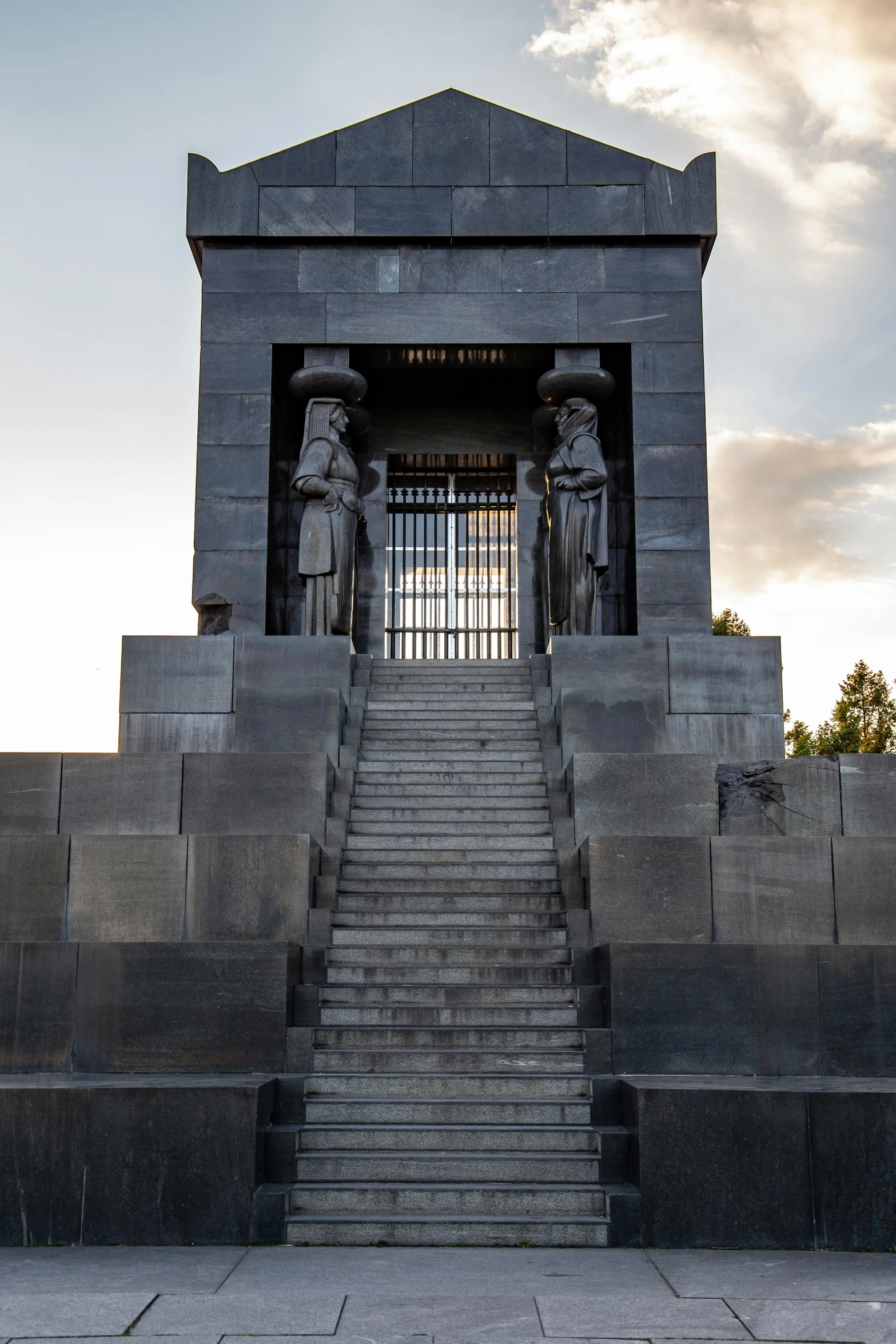 the entrance to a building with stairs leading up to it