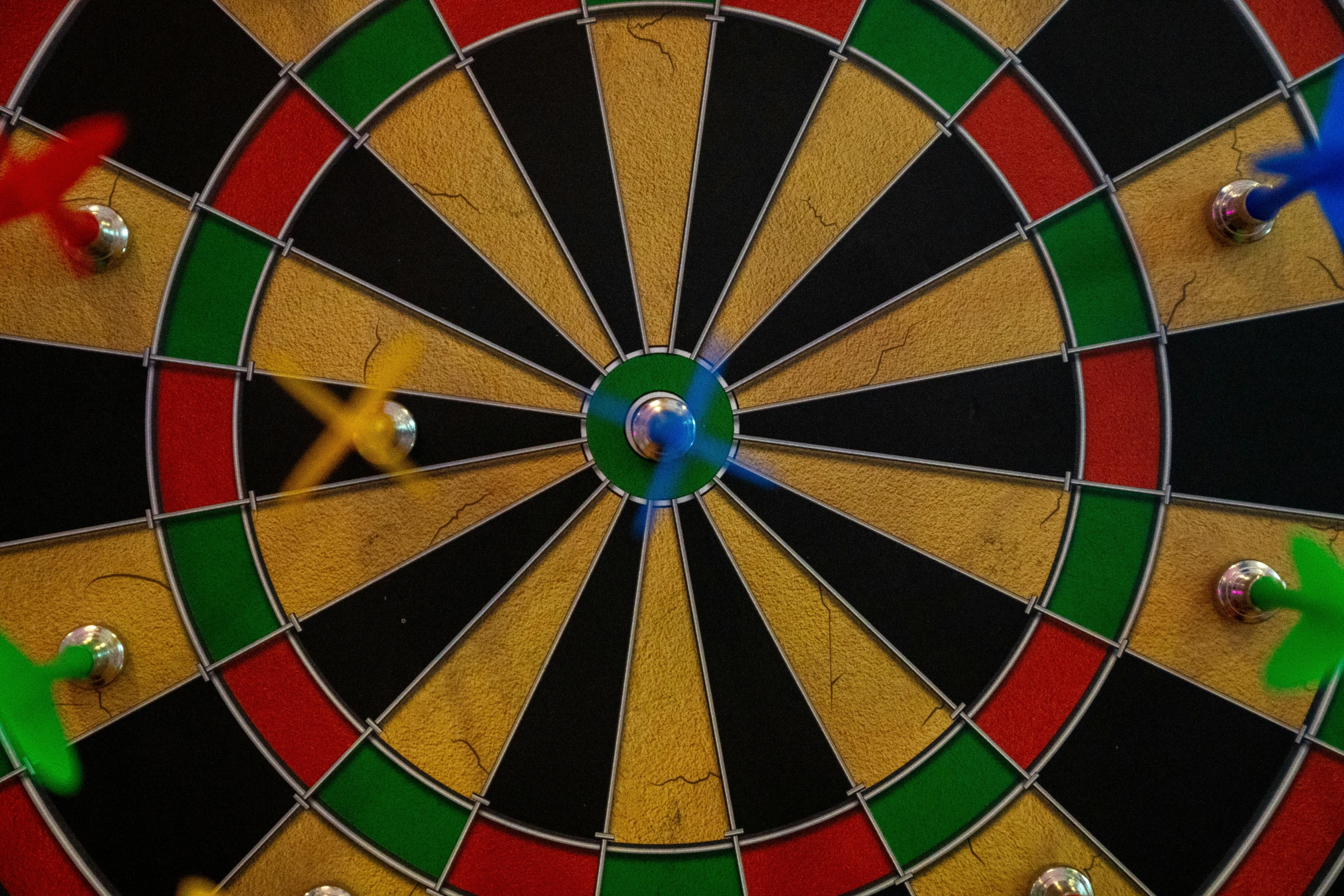 a close up view of a colorful dart hitting at an olympic event