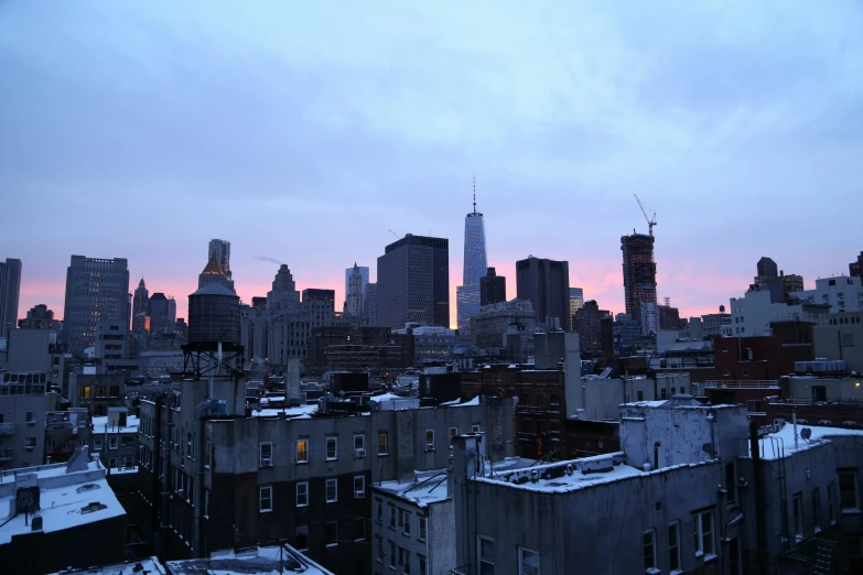 a view of an urban city from above at dusk