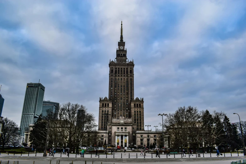 large building with two towers surrounded by trees