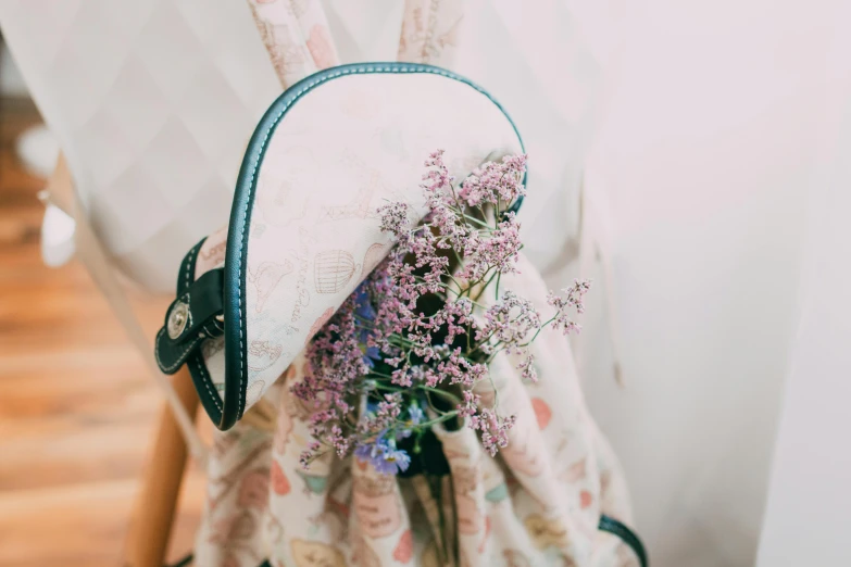 this is a purse with flowers in it