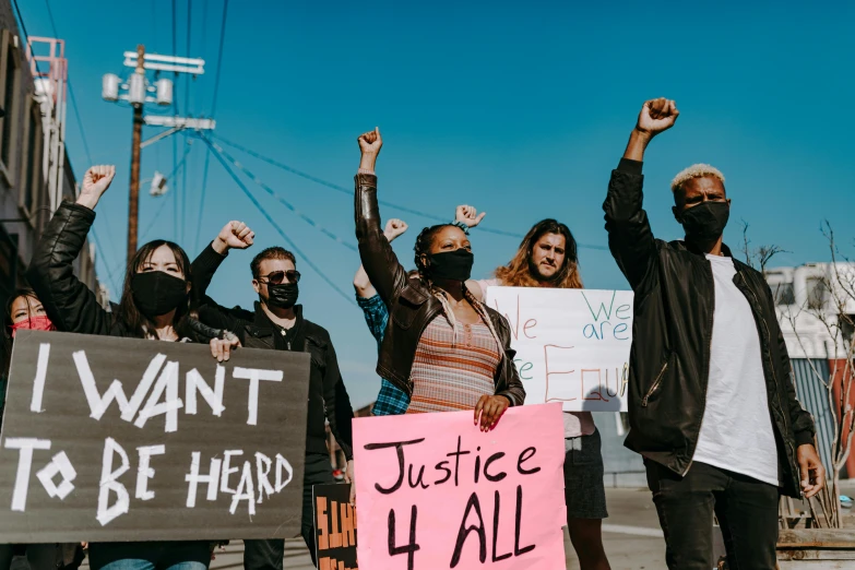 a group of people holding up signs at an anti - nuclear protest