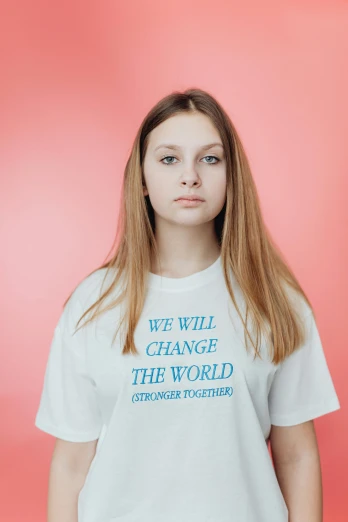 a woman with long hair and a t - shirt with words