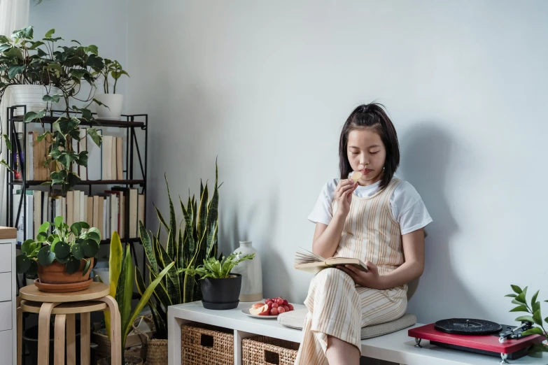 a woman sitting on a bench in a living room