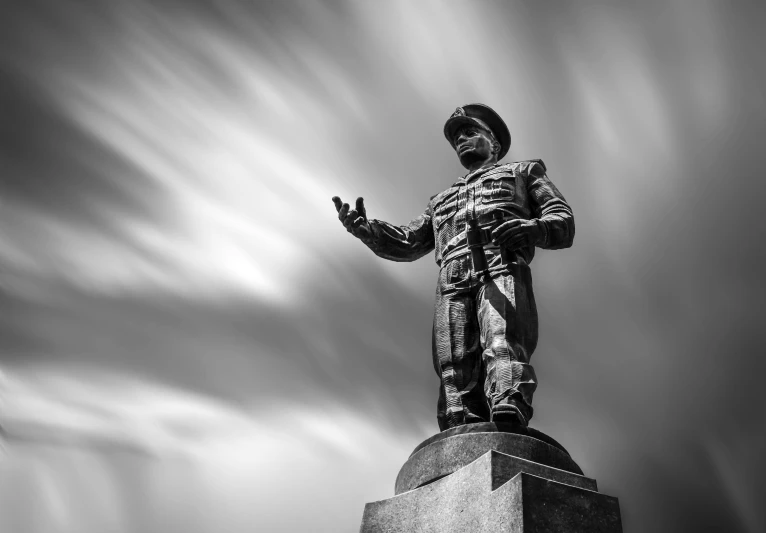 a black and white po of a statue of a man