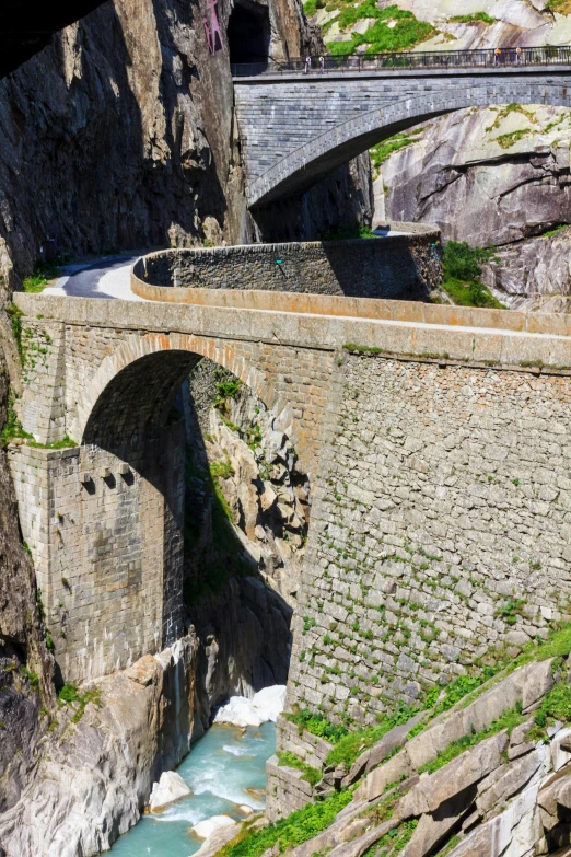 a big bridge that has a train going over it