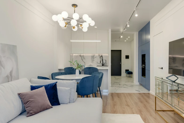 a white living room filled with furniture and decor