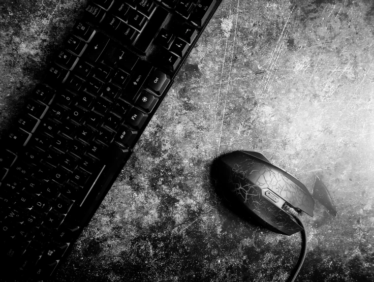 a computer mouse and keyboard laying on the floor