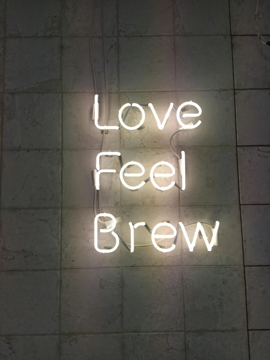 a neon sign that says love feed brew