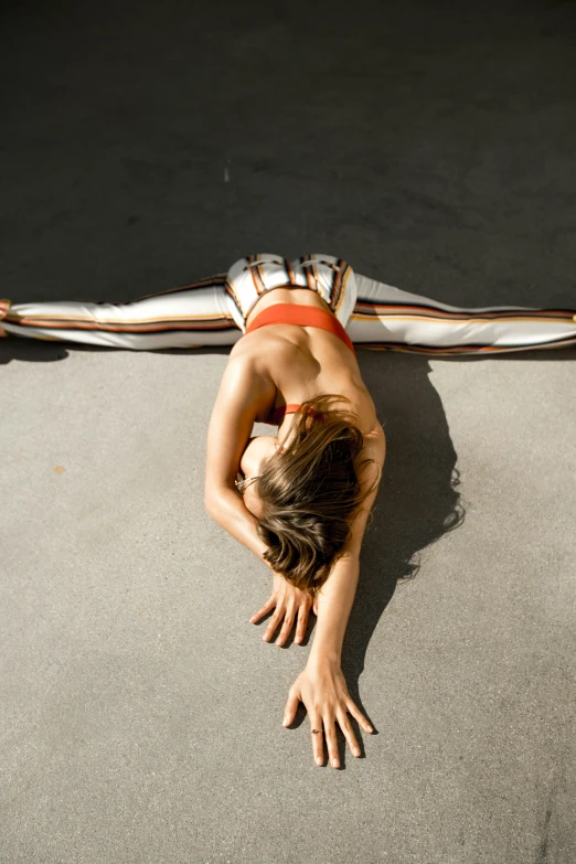 a person in a red bikini lays on her stomach