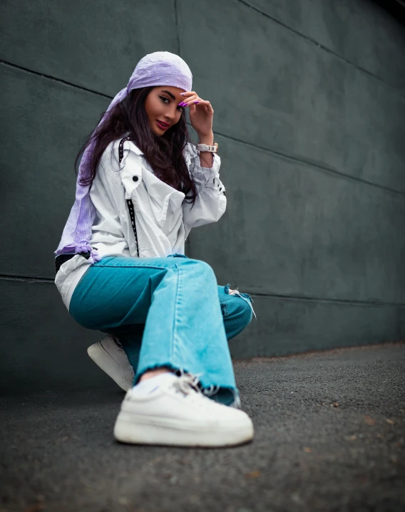 a girl with purple hair, wearing a white shirt and turquoise pants