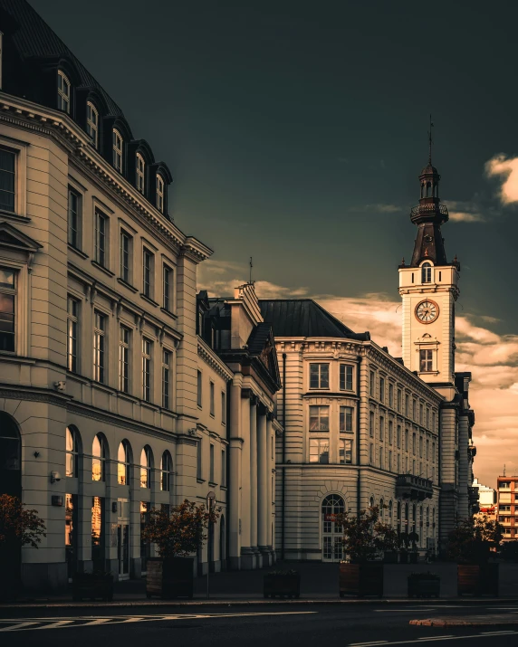 a street scene with the sun shining down on buildings