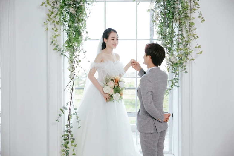 a beautiful bride stands by her groom for the first look