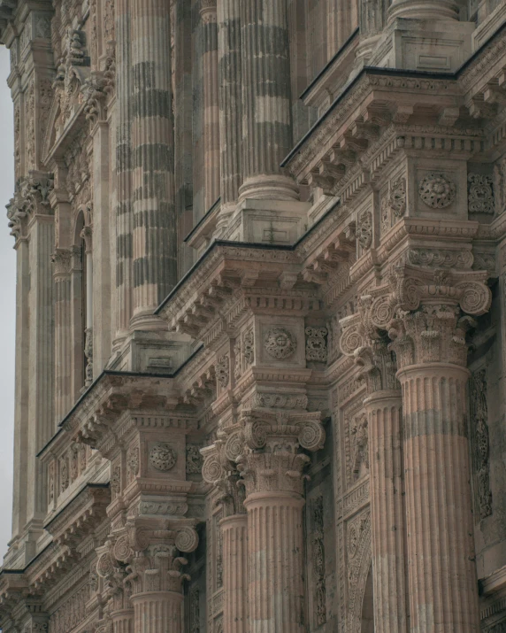 an architectural tower with many clocks attached to it