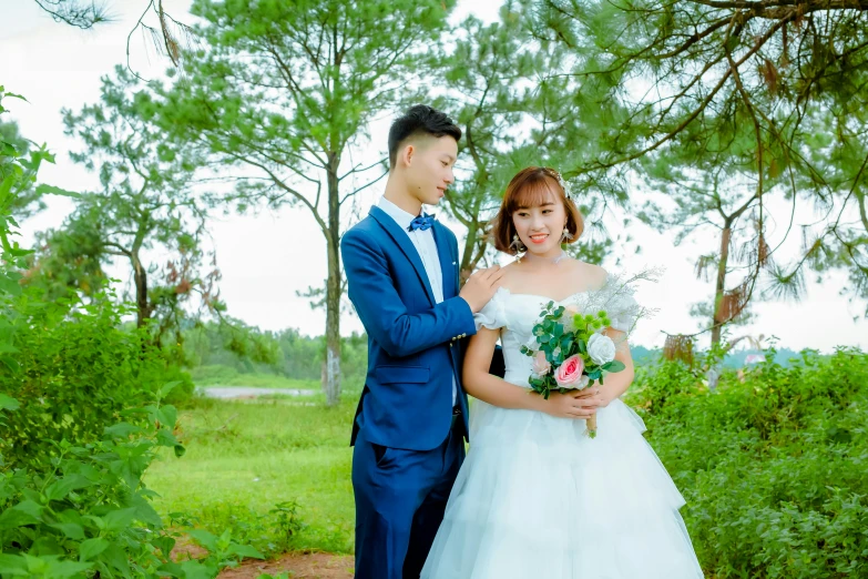 a man and woman dressed up by wedding attire