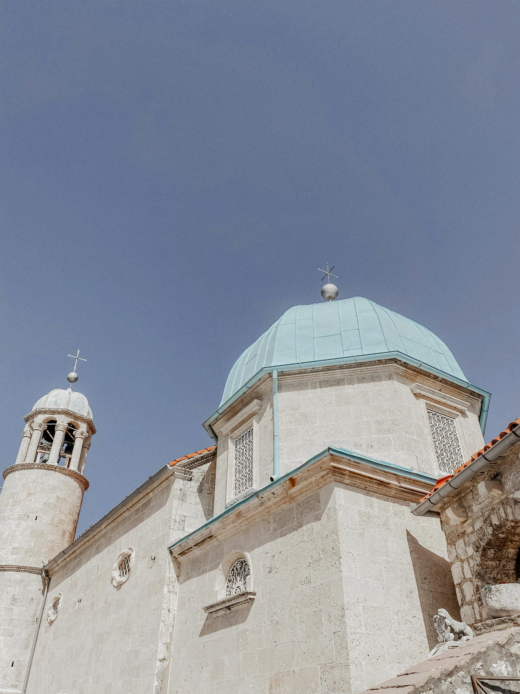 a large white building has a blue roof