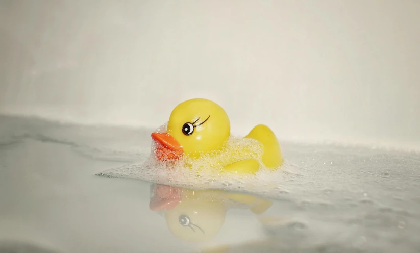 a rubber ducky that is floating in the water