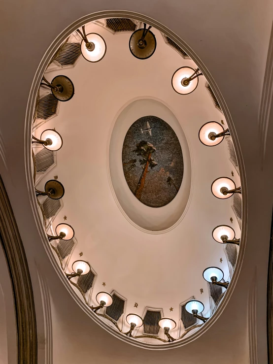 round light fixture in the ceiling, with a clock in it