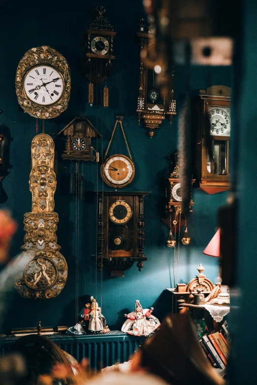 a room filled with lots of different clocks on the wall