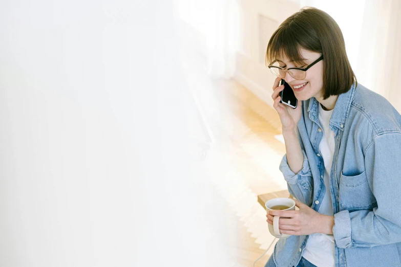 a woman standing and talking on a cell phone