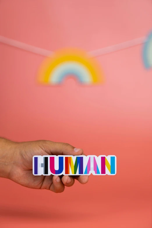 hand holding a magnet spelling the word'mummy '