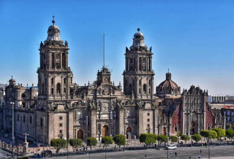 an ancient mexican church stands in a beautiful city