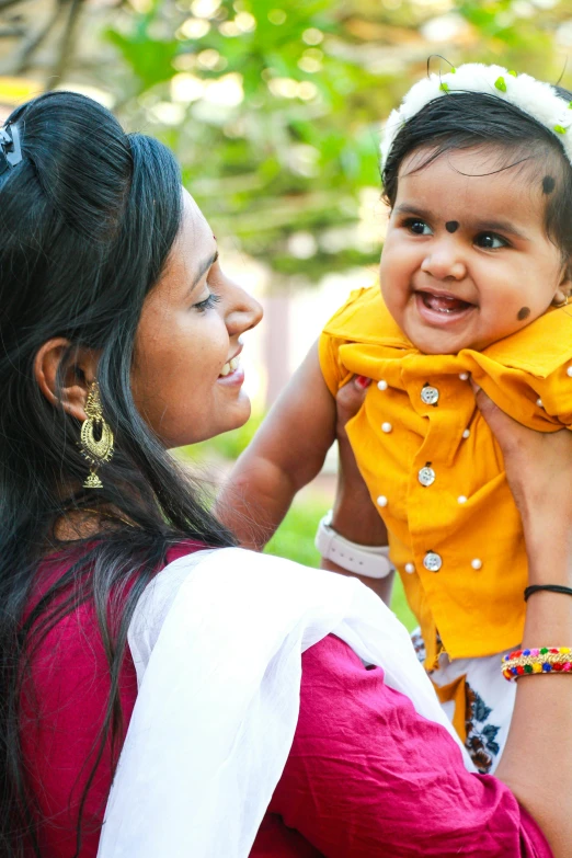 an adorable little girl smiling with a big smile