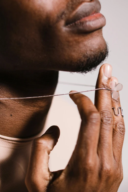 a person tying the strings with their hands