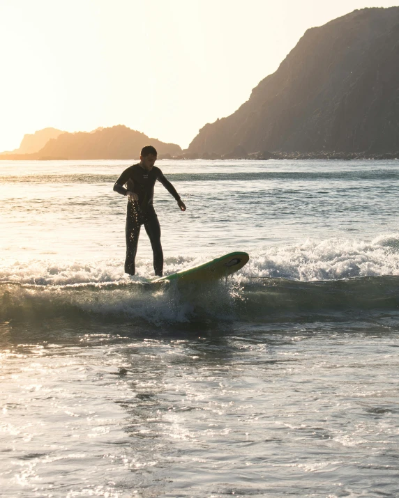 there is a man that is on a surfboard in the water