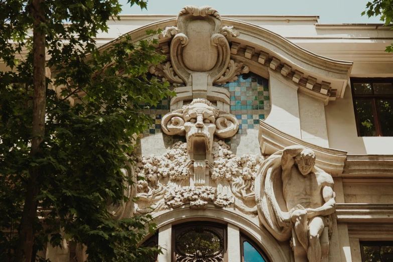 the front facade of a building with decorative designs on it