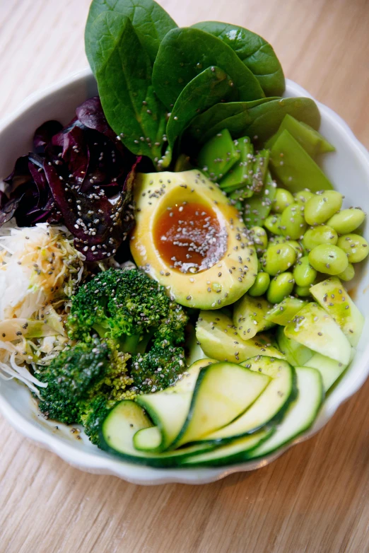 a bowl with vegetables that have been arranged in it