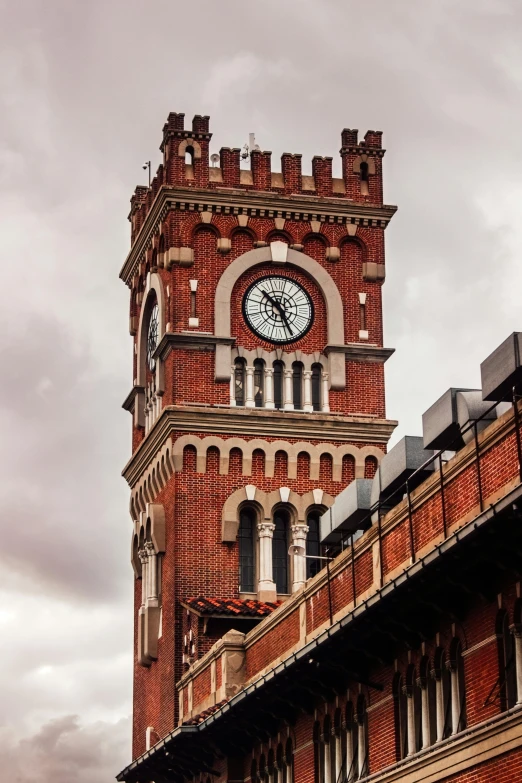 a clock tower has the sky and clouds in it