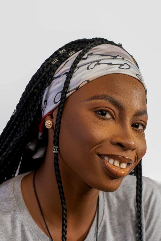 a woman is smiling while she has ids on her head