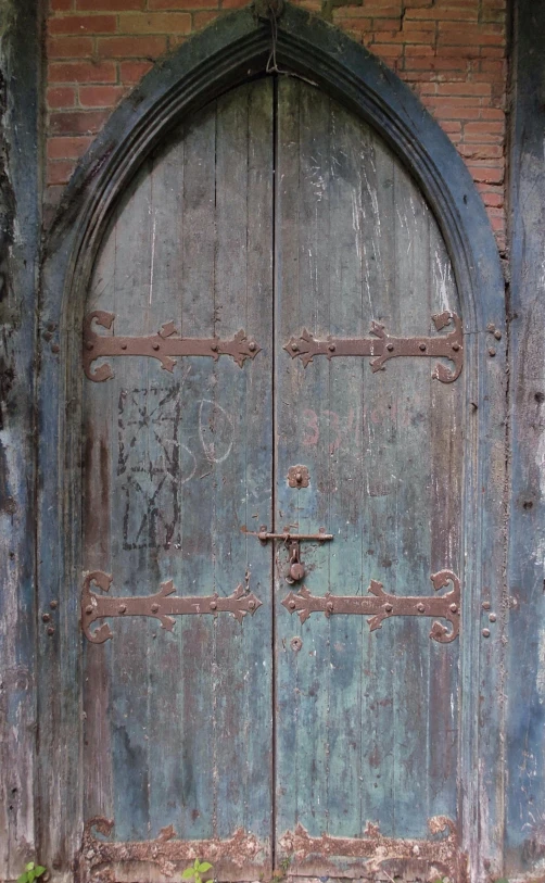 an old wooden door is in a building