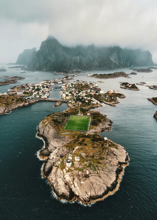 an island is shown with green grass and water