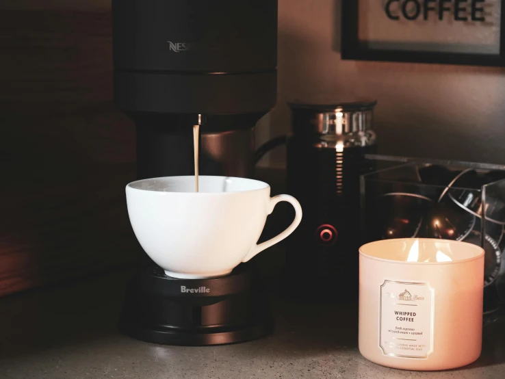 coffee being poured into a coffee cup