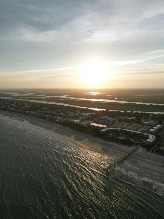 an aerial view of a city on the shore